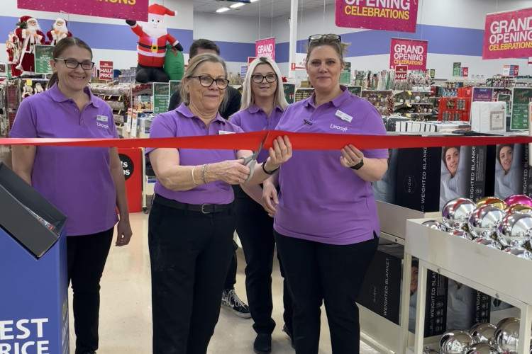 Manager Leanne Bayntun with the store staff members cutting the ribbon at the Caboolture Lincraft Grand Opening on November 17.