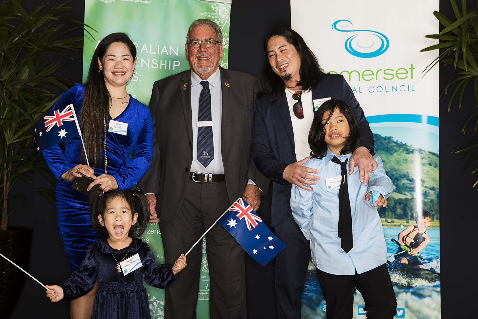 Mayor Graeme Lehmann enjoys a moment with a family of new Aussies at the citizenship ceremony on 1 September at the Somerset Civic Centre in Esk.