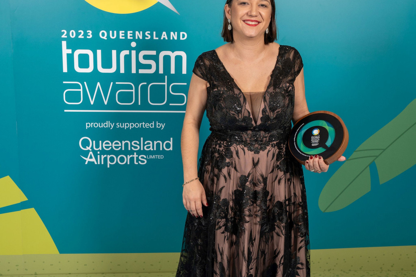 MBRIT CEO Natassia Wheeler accepting the gold award at the Queensland Tourism Awards.