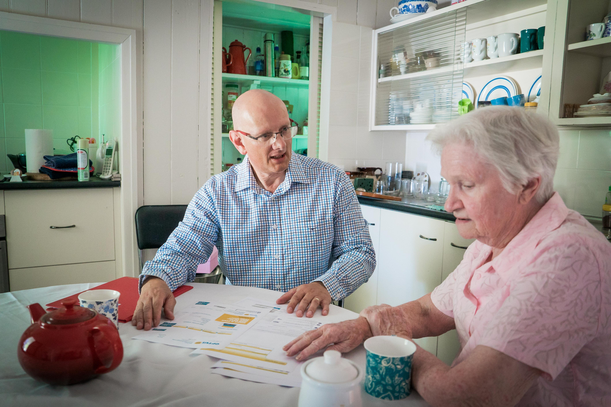 Federal Member for Blair Shayne Neumann talks to a local pensioner about cost of living issues and government assistance for seniors.