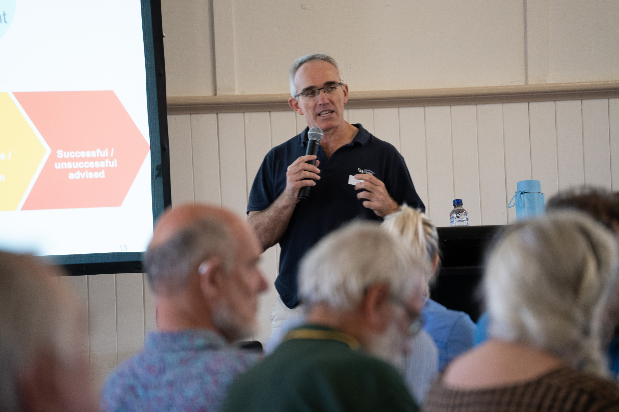 Executive General Manager (EGM), Delivery, Geoff Scott at a community forum.