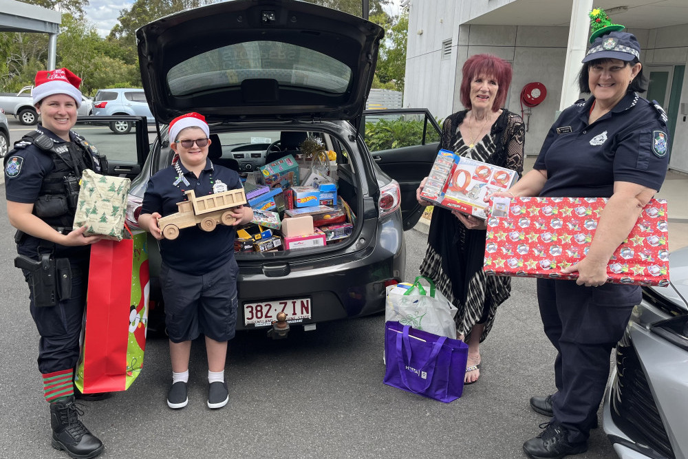 Tegan Tonkin, Charlie Shackcloth, Denise Glasgow and Jo-Anne Arthur had the police vehicles packed with presents ready for Santa.