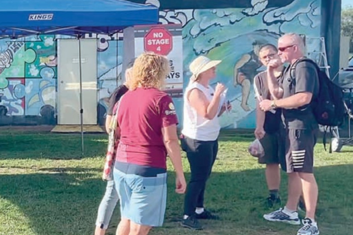Representative residents talk to people at the Caboolture Markets.
