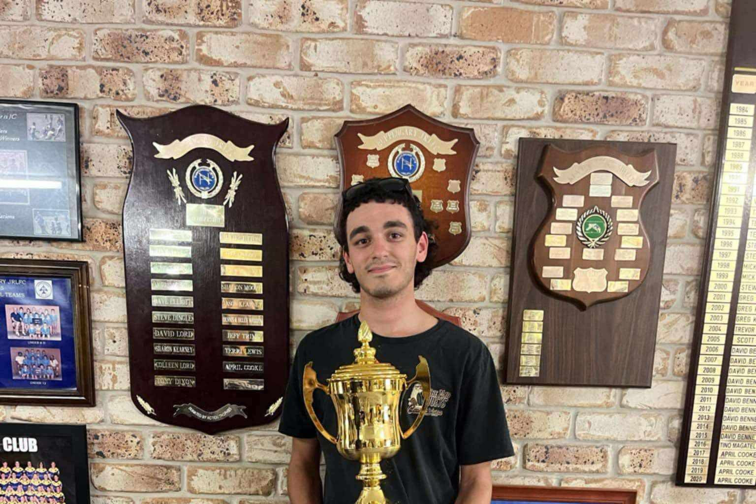 Cookie’s son, Bradley, holding the inaugural Cookie Cup trophy.