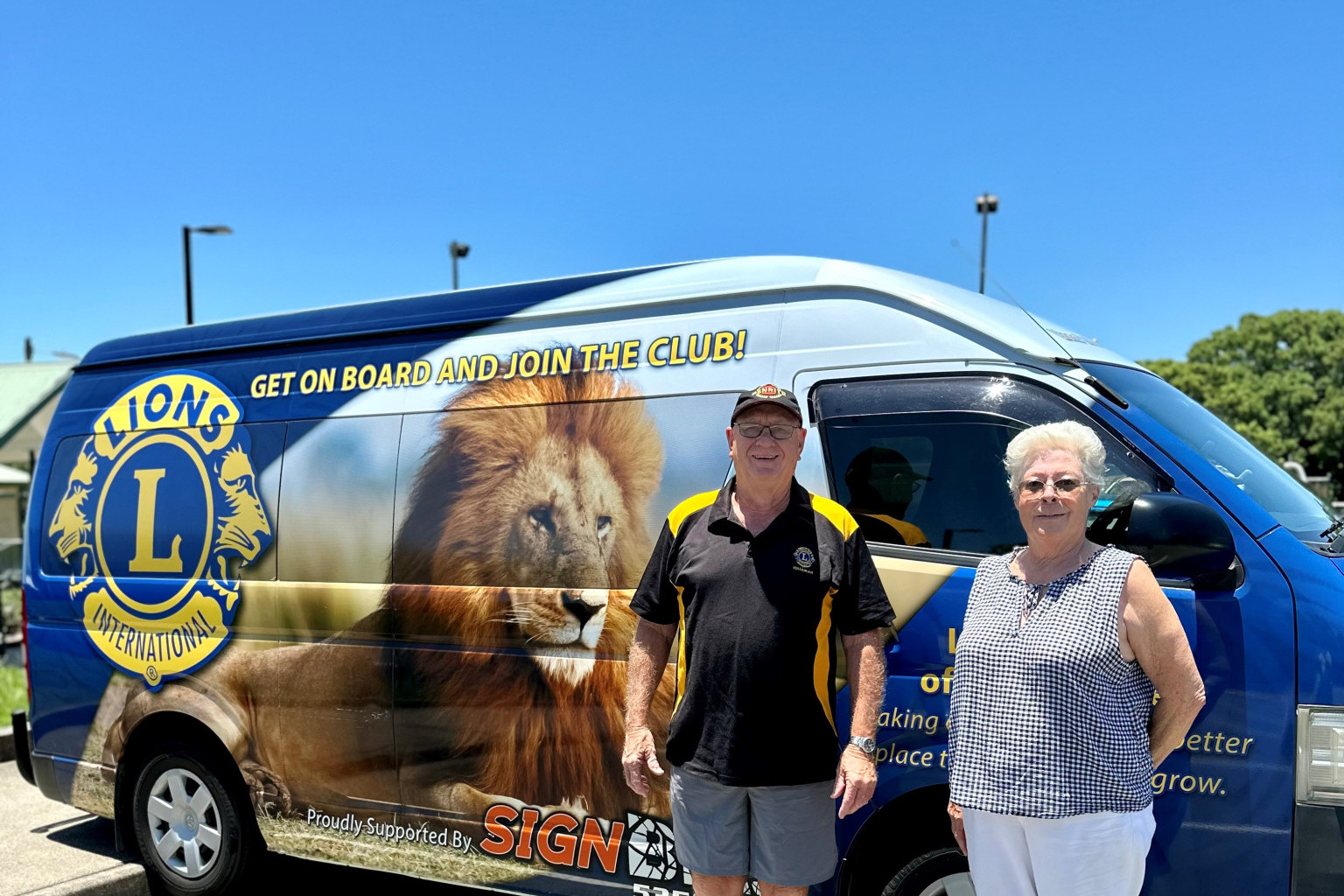 Wamuran Lions Club duo Brian McAtee and Michelle Kalms with the 11-seater bus, now in possession of the club.