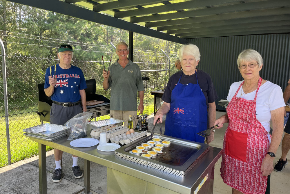 Gary, Mike, Jackie and Vonnie from the combined churches community on barbeque duty, preparing the free breakfast for Australia Day at Woodford Pool.