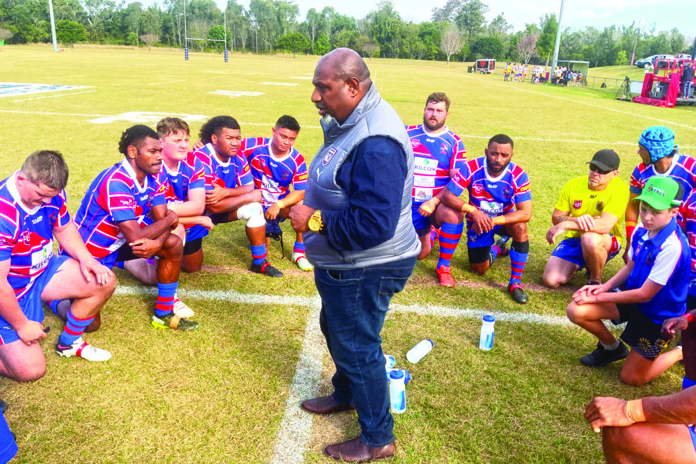 Edward Monaei speaks to the Kilcoy Yowies as they “take a knee” during the half-time break in last Saturday’s Kilcoy versus Pomona-Cooran rugby league battle on Kilcoy soil.