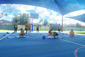 Students playing goalball.
