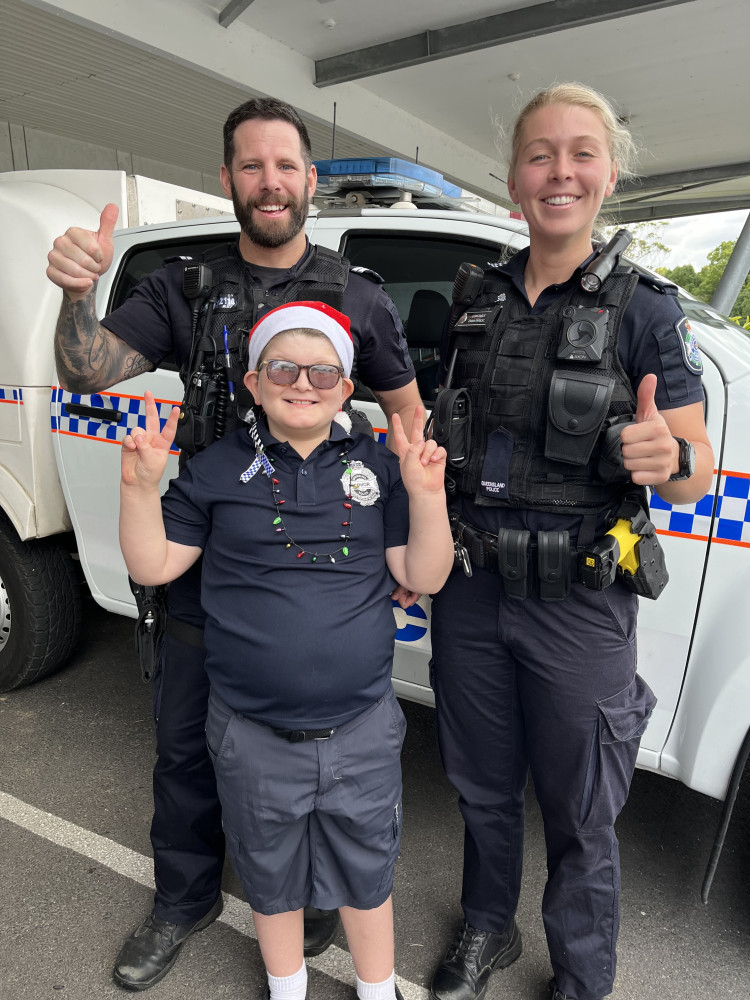 Chris Mukavec, Charlie Shackcloth and Emma Pericic getting geared up to help Santa deliver presents to disadvantaged children in Caboolture.