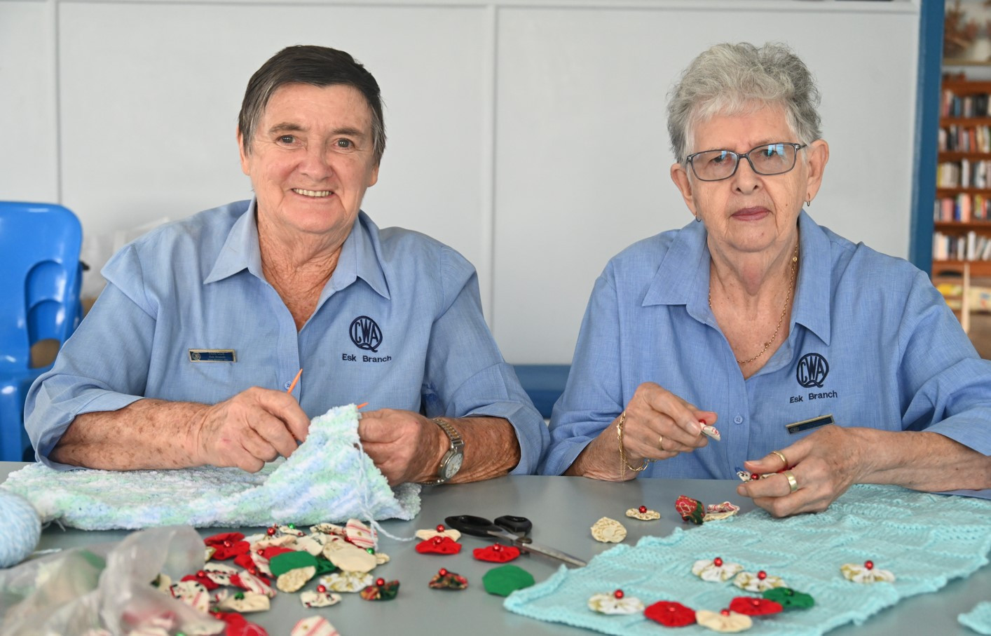 Pamela (left) and Valerie (right) knitting the tree sweaters.