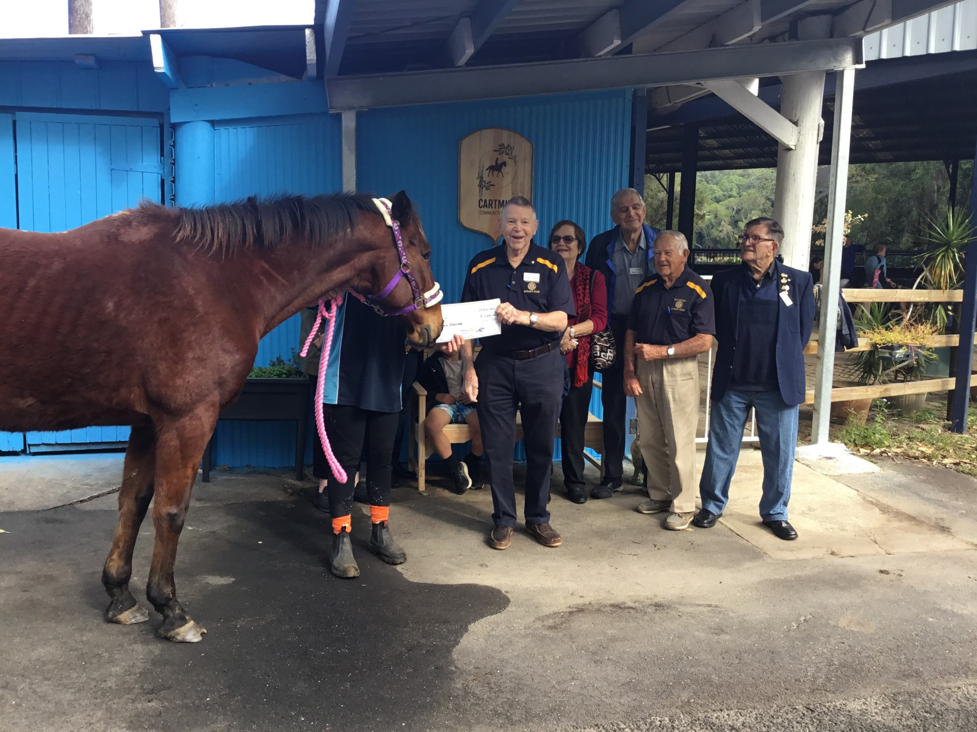 Allen Collishaw presenting sponsorship check for $1000.