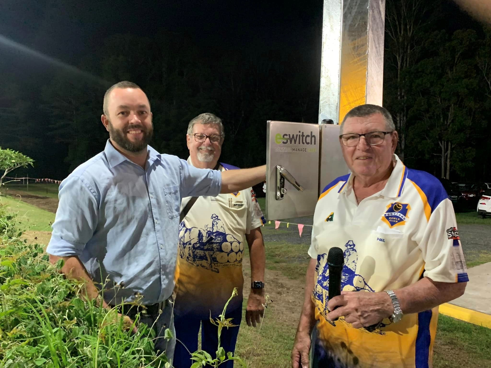 Tony Latter (far left) had the honour of switching on the new floodlights at the Woodford Bowls Club.