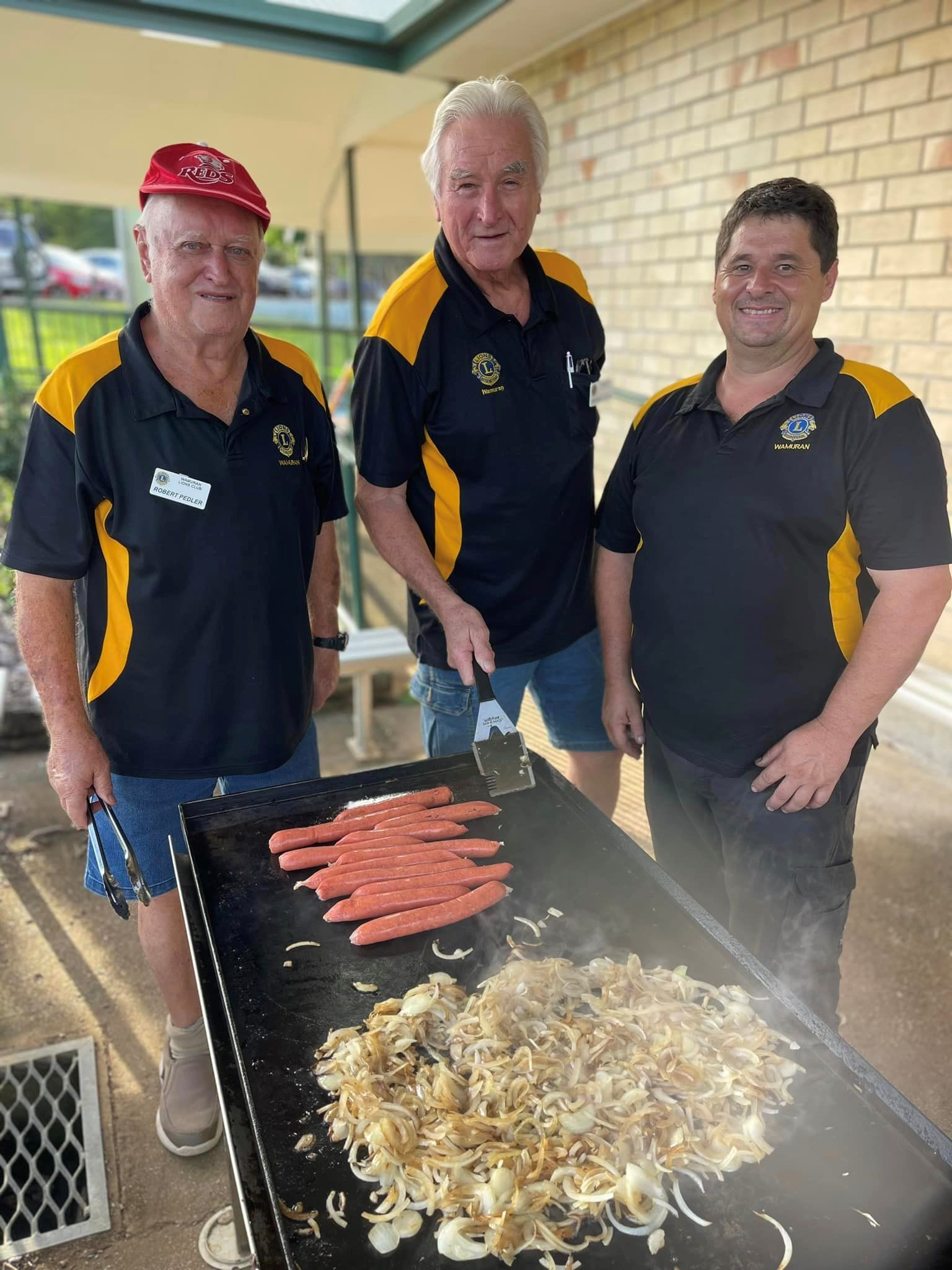 Wamuran Lions trio Robert Pedler, Peter LeCerf and John Abraham cook up a storm at the recent community BBQ.